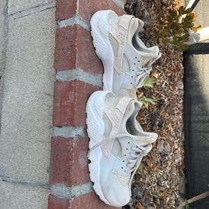 The shoes are a cream & grey color